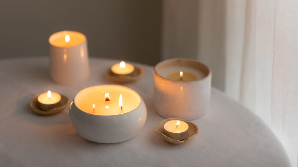 selection of lit scented candles